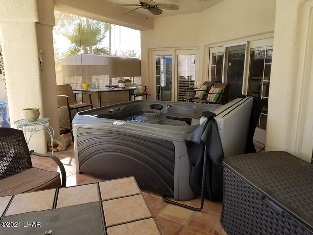 sunroom / solarium with ceiling fan