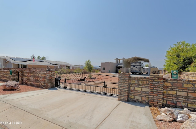 view of gate with fence