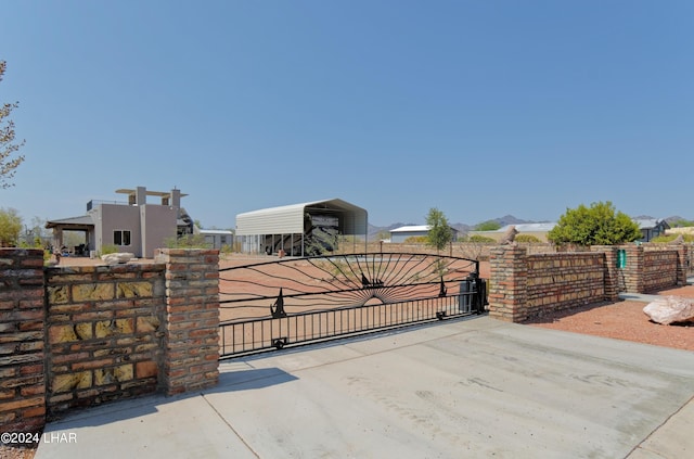 view of gate with fence