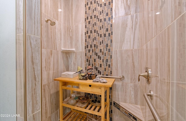 bathroom with a tile shower