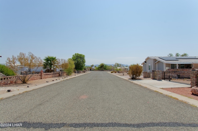 view of road featuring a gate