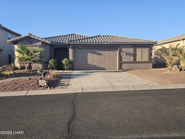 view of front of home with a garage