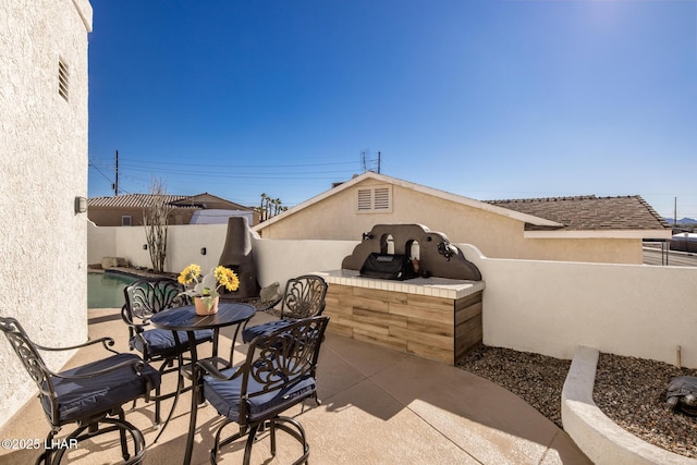 view of patio featuring a fenced in pool