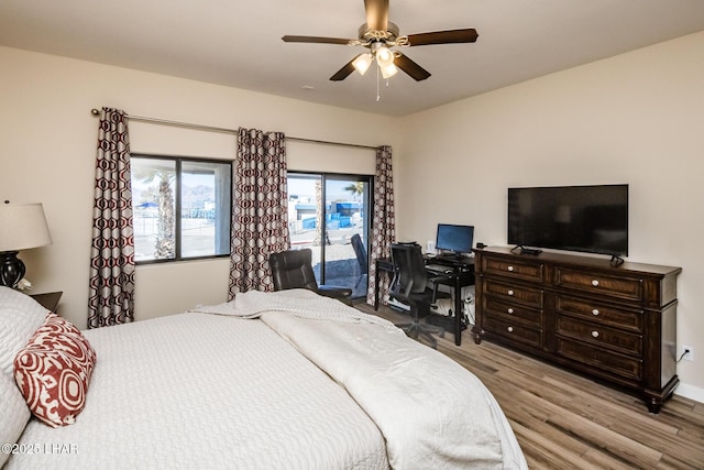 bedroom featuring ceiling fan and light wood-type flooring