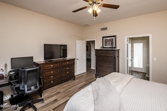 bedroom with hardwood / wood-style flooring and ceiling fan