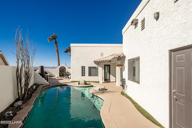 view of pool featuring a patio