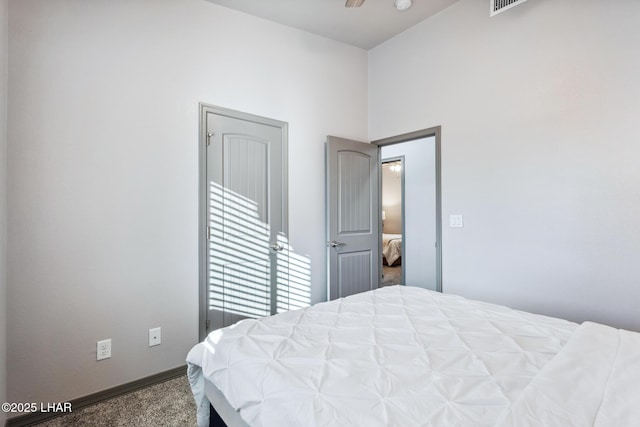 bedroom with baseboards and carpet floors