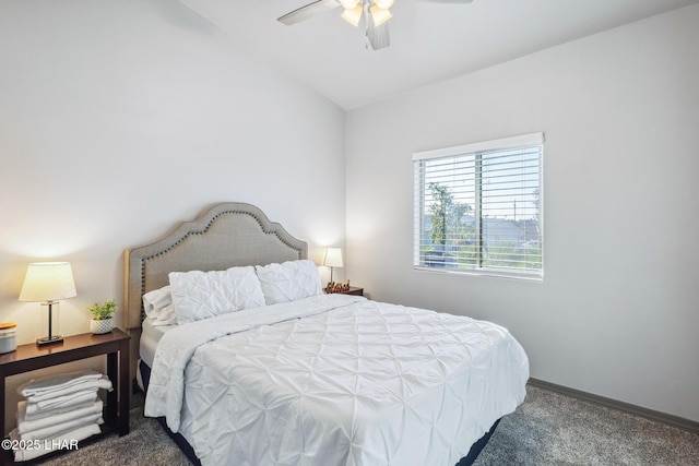 carpeted bedroom featuring ceiling fan, baseboards, and vaulted ceiling