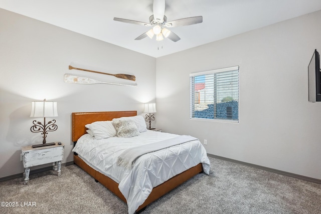 bedroom with baseboards, carpet floors, and a ceiling fan