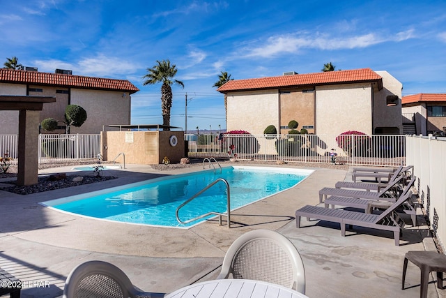 view of swimming pool with a patio area