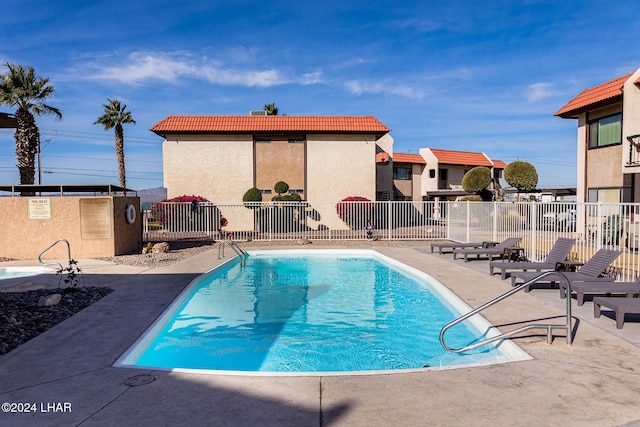 view of swimming pool with a patio