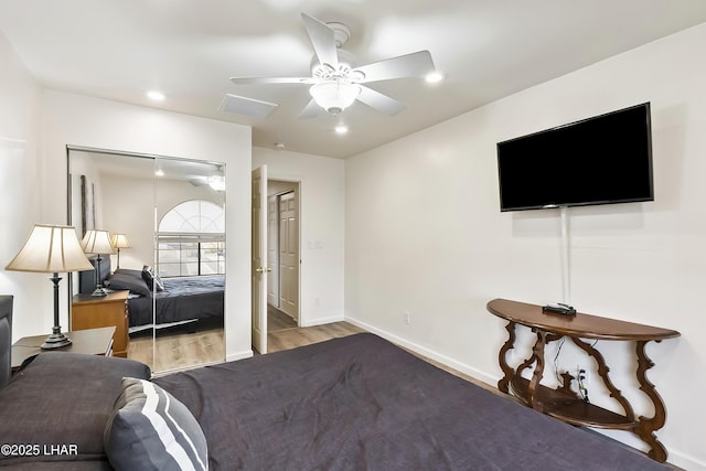 bedroom featuring ceiling fan and light wood-type flooring