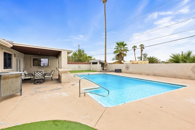 view of swimming pool with a patio