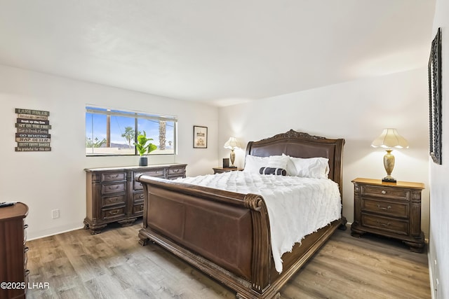 bedroom with light hardwood / wood-style floors