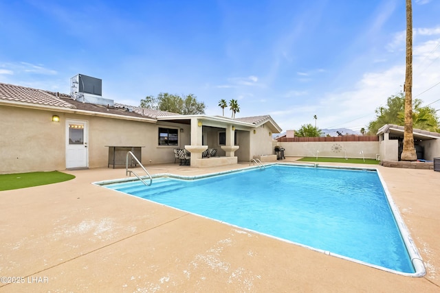 view of pool featuring a patio