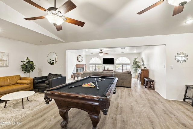 game room with vaulted ceiling, pool table, ceiling fan, and light wood-type flooring