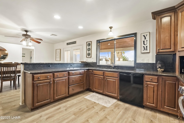 kitchen with sink, light hardwood / wood-style flooring, kitchen peninsula, and dishwasher