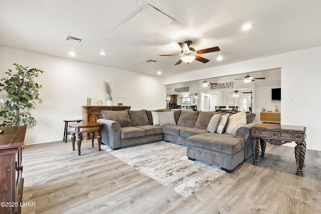 living room with light hardwood / wood-style flooring