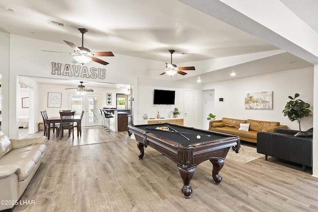 rec room with billiards, lofted ceiling, and light wood-type flooring