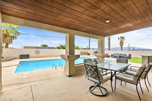 view of pool featuring a patio