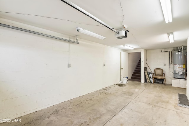 garage with a garage door opener and gas water heater