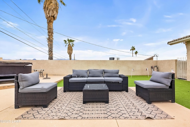 view of patio featuring a hot tub and an outdoor hangout area