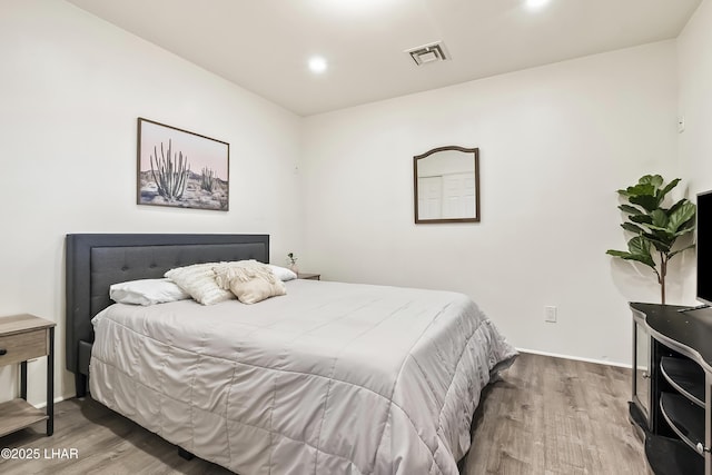 bedroom featuring hardwood / wood-style floors