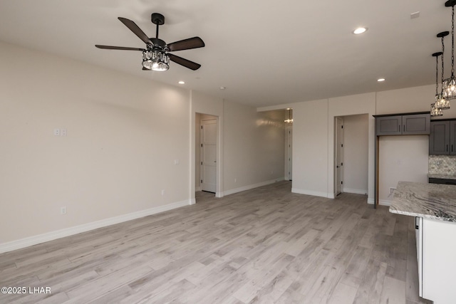 1650 E Sandra Dr, Lake Havasu City, AZ 86404 - unfurnished living room with a ceiling fan, light wood finished floors, recessed lighting, and baseboards