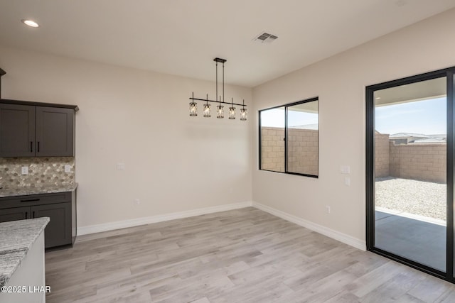 1650 E Sandra Dr, Lake Havasu City, AZ 86404 - unfurnished dining area featuring light wood-style floors, baseboards, and recessed lighting