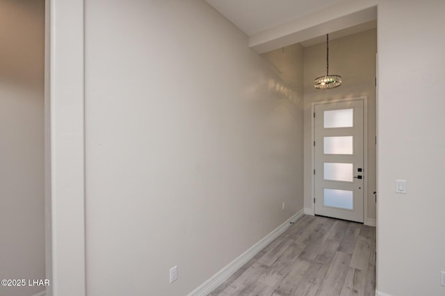 1650 E Sandra Dr, Lake Havasu City, AZ 86404 - doorway to outside featuring light wood-style flooring, a chandelier, and baseboards