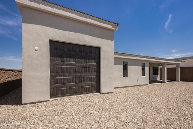 1650 E Sandra Dr, Lake Havasu City, AZ 86404 - back of house featuring stucco siding, a tile roof, and a garage