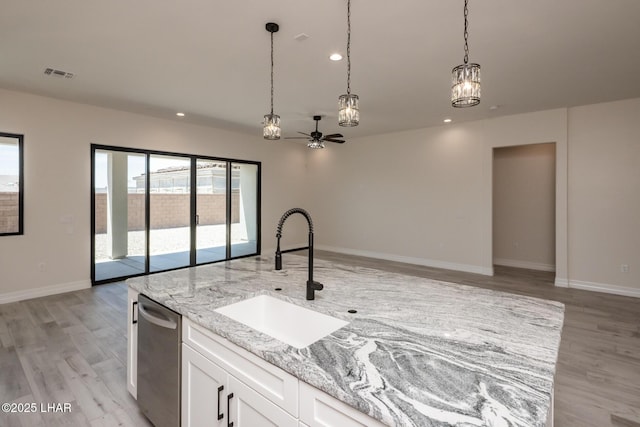 1650 E Sandra Dr, Lake Havasu City, AZ 86404 - kitchen featuring a sink, open floor plan, light wood-style floors, light stone countertops, and recessed lighting