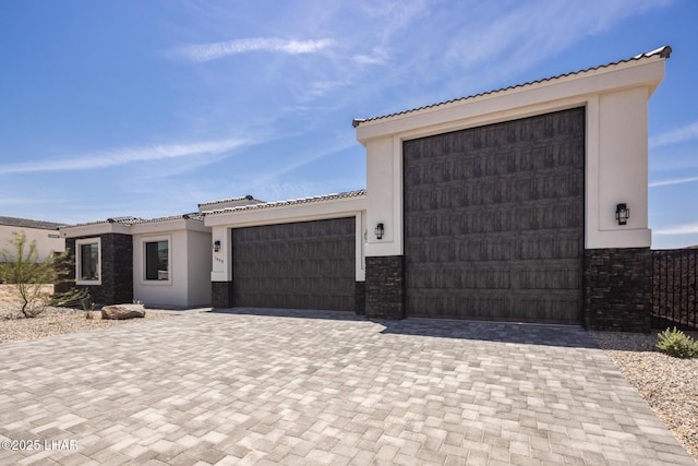 1650 E Sandra Dr, Lake Havasu City, AZ 86404 - view of front of property with stucco siding, a garage, a tiled roof, and decorative driveway
