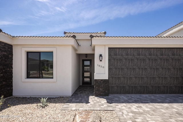 1650 E Sandra Dr, Lake Havasu City, AZ 86404 - entrance to property featuring stucco siding, a garage, a tiled roof, and driveway