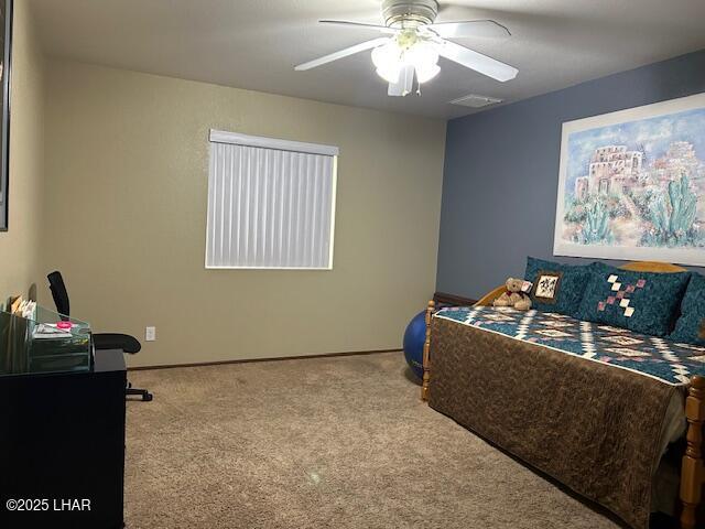 carpeted bedroom featuring ceiling fan