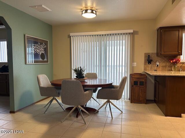 dining room featuring light tile patterned floors