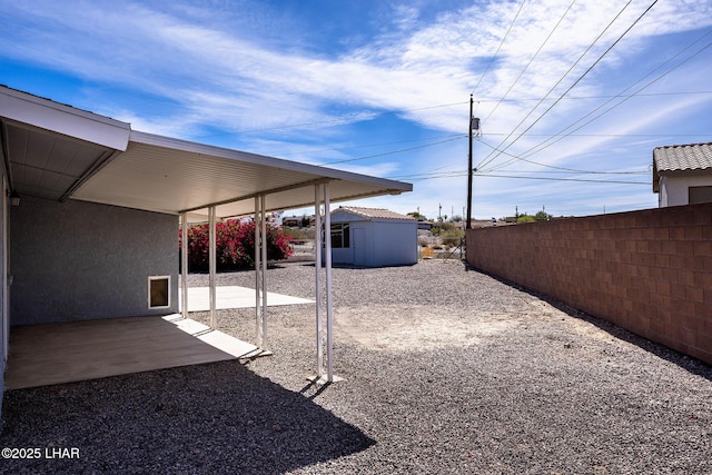 1880 Biscayne Ln, Lake Havasu City, AZ 86403 - view of yard with a patio, fence, an outdoor structure, and a shed