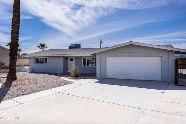 1880 Biscayne Ln, Lake Havasu City, AZ 86403 - ranch-style house with fence, driveway, stucco siding, and an attached garage