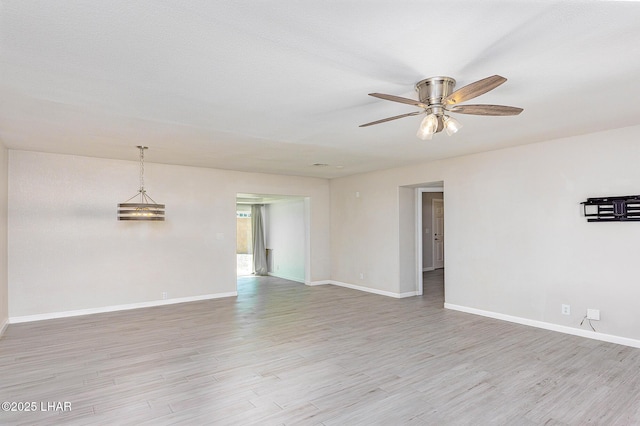 1880 Biscayne Ln, Lake Havasu City, AZ 86403 - unfurnished room featuring baseboards, light wood-style floors, and a ceiling fan