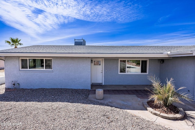 1880 Biscayne Ln, Lake Havasu City, AZ 86403 - view of front of house featuring stucco siding and roof with shingles