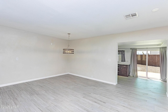 1880 Biscayne Ln, Lake Havasu City, AZ 86403 - spare room featuring baseboards, light wood finished floors, and visible vents
