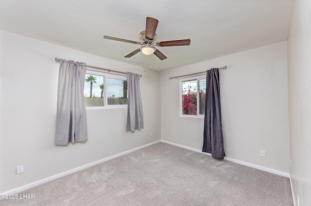 1880 Biscayne Ln, Lake Havasu City, AZ 86403 - empty room featuring plenty of natural light, baseboards, ceiling fan, and carpet floors