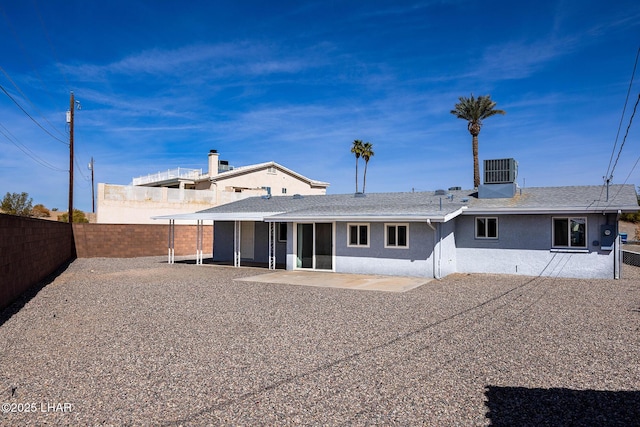 1880 Biscayne Ln, Lake Havasu City, AZ 86403 - rear view of house with central air condition unit, stucco siding, a fenced backyard, and a patio area