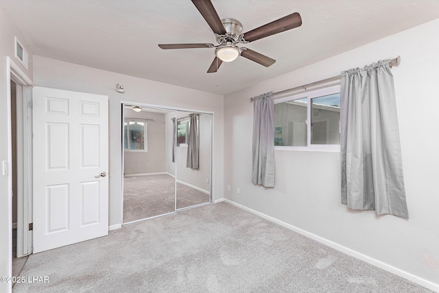 1880 Biscayne Ln, Lake Havasu City, AZ 86403 - unfurnished bedroom featuring a closet, carpet floors, baseboards, visible vents, and ceiling fan