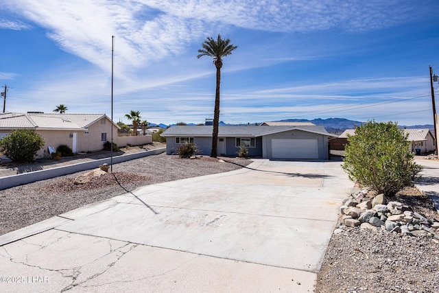 1880 Biscayne Ln, Lake Havasu City, AZ 86403 - ranch-style home featuring stucco siding, an attached garage, and concrete driveway
