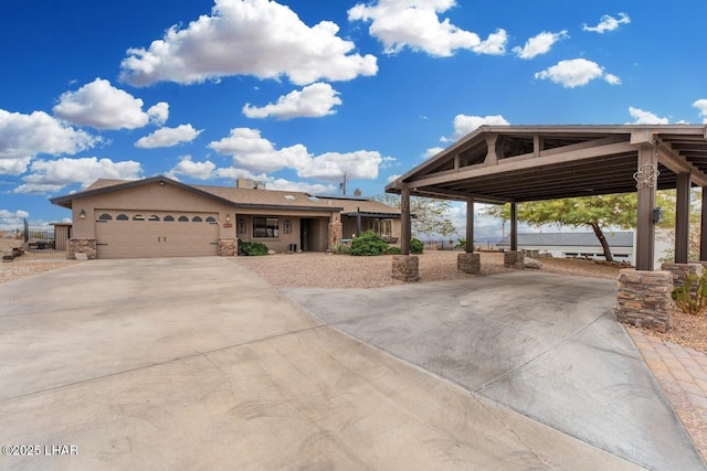 view of front of house with a garage and a water view