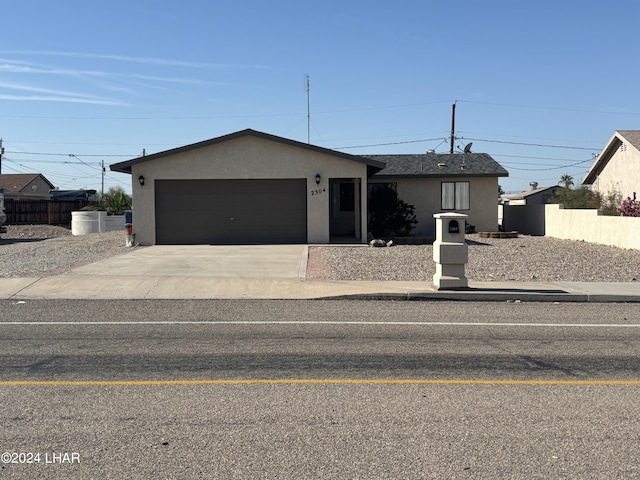 ranch-style house featuring a garage