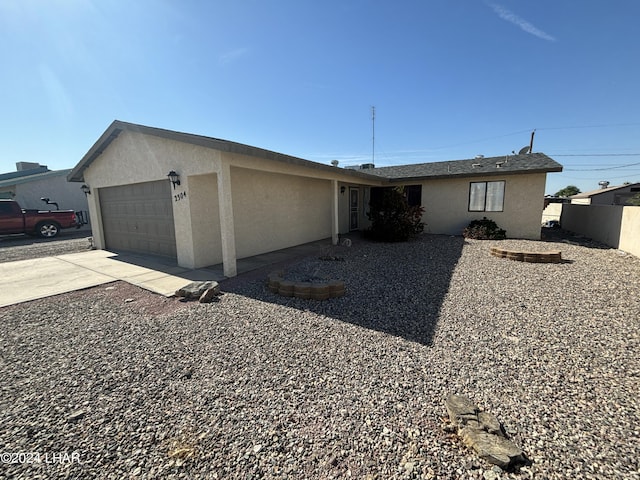 single story home featuring a garage