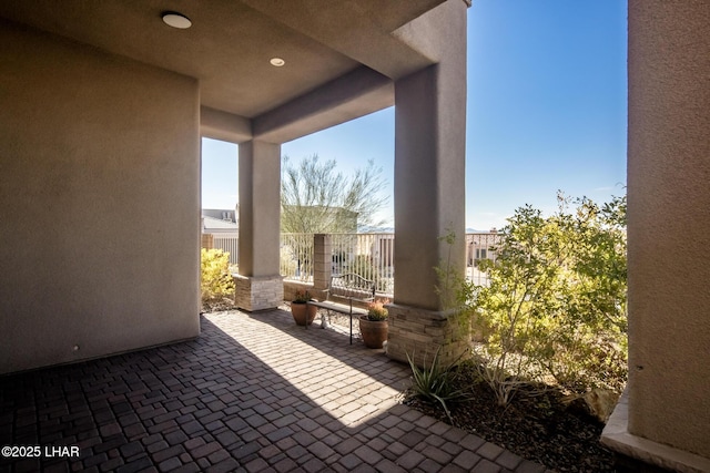 view of patio / terrace featuring fence