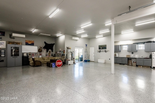 garage featuring a wall unit AC and a wall mounted AC